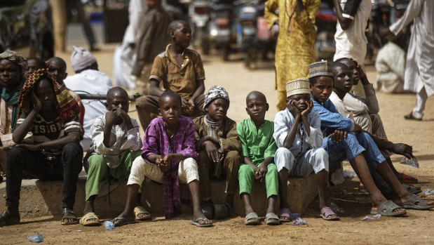 Young Muslim boys wait for traditional Friday prayers to begin at a mosque in Kano, northern Nigeria.