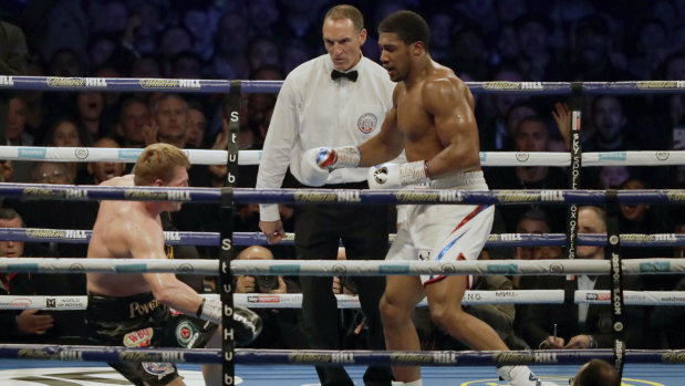 Povetkin hits the canvas after a punch from Joshua.