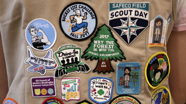 Patches cover the back of a US Girl Scout's vest at a demonstration of some of their activities in Seattle.