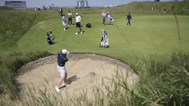 England’s Sam Horsfield plays out of a bunker on the 6th green during a practice round for the British Open on Tuesday. 