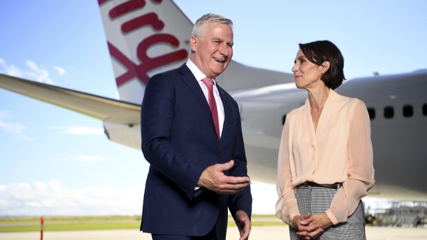 Virgin Australia CEO Jayne Hrdlicka and Deputy Prime Minister Michael McCormack at the Brisbane Airport.