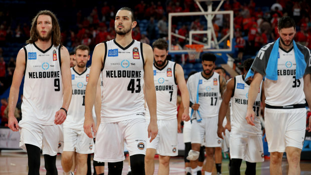 Opportunity lost: Melbourne United players leave the court after losing game three of the finals series to Perth on Friday night.