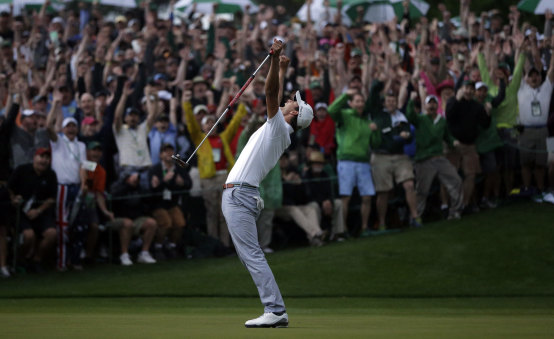 April 14, 2013: Adam Scott makes a birdie putt on the second playoff hole to win the Masters at Augusta.
