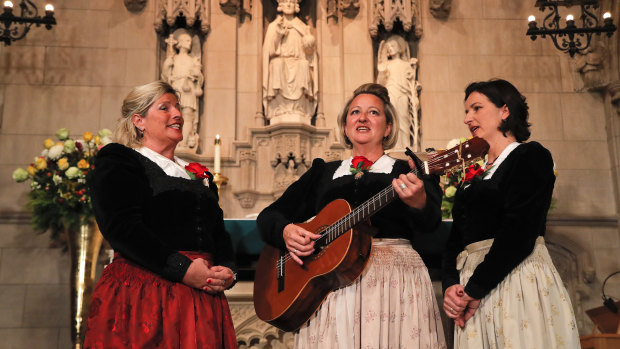The Kroell Family Singers sing  during a celebration of the song "Silent Night" at Trinity Church in New York.