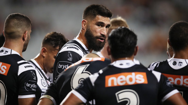 James Tamou gives a pep talk to Tigers teammates behind the line after another Titans try.