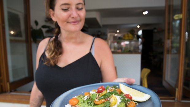 Anne Cooper with a plate of avocado toast at Morris in Paddington.