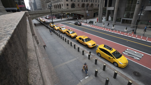 Yellow cabs line and empty 42nd St. waiting for fares outside Grand Central Terminal this week. 