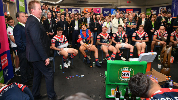 Trent Robinson addresses the Roosters players after last year's grand final victory.