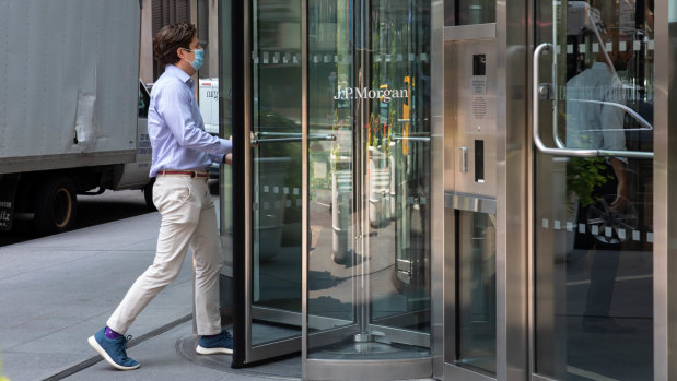 An office worker goes to work at JP Morgan in Wall Street’s new dress code - chinos and sneakers.