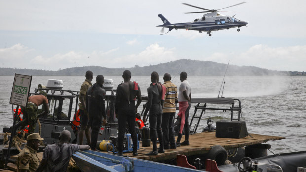 A helicopter searches on Sunday for victims of a boat accident on Lake Victoria, near the Ugandan capital Kampala.