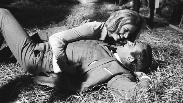 Honor Blackman as Pussy Galore and Sean Connery as James Bond filming a fight scene which develops into a love scene in Goldfinger, 1964.