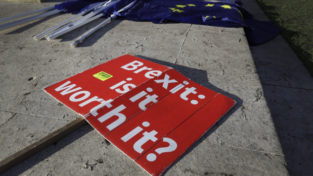 Brexit banners lie on the ground near Parliament in London.