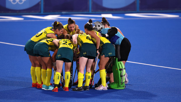 Australia players huddle on pitch during the Women’s Preliminary Pool B match between New Zealand and Australia.