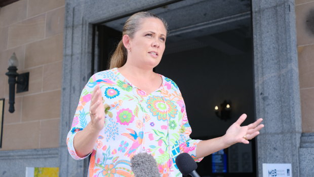 Tracey Price spoke to reporters outside City Hall this afternoon.