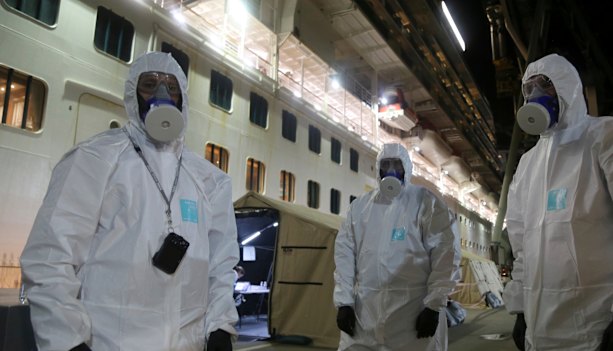 Police officers prepared to board the Ruby Princess to seize evidence for an investigation while it was docked in Wollongong. 