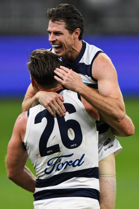 Isaac Smith and Tom Hawkins celebrate a goal in the Cats’ semi-final win over the Giants at Optus Stadium.