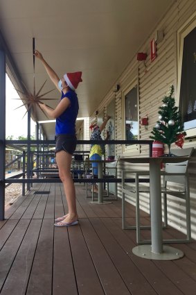 Romy from Prahran and Carminda from Brisbane decorate Block D at  Howard Springs on Christmas Eve.