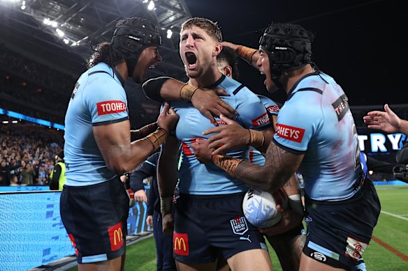 Zac Lomax celebrates after scoring a try for the NSW Blues.