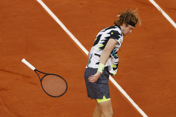 Andrey Rublev throws his racquet during the French Open men’s singles quarterfinals. 