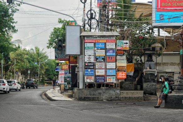 A Gojek driver waiting for an order at the end of Popies Lane 1 in Kuta.