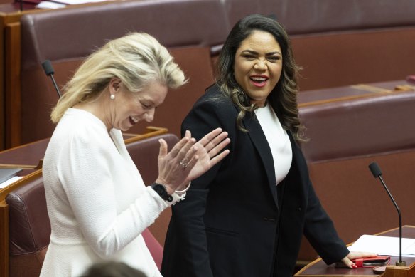 Senator Bridget McKenzie applauds Senator Jacinta Nampijinpa Price at Parliament House on Monday. 