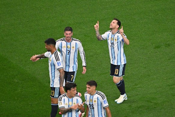 Argentina’s Lionel Messi, right, celebrates scoring his side’s opening goal.