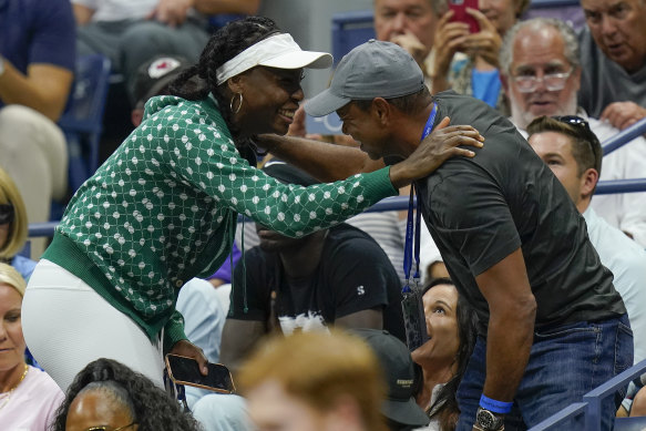 Woods greets Venus Williams during Serena’s second-round win over Estonian second seed Anett Kontaveit.