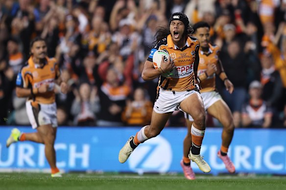 Jarome Luai races clear to score.