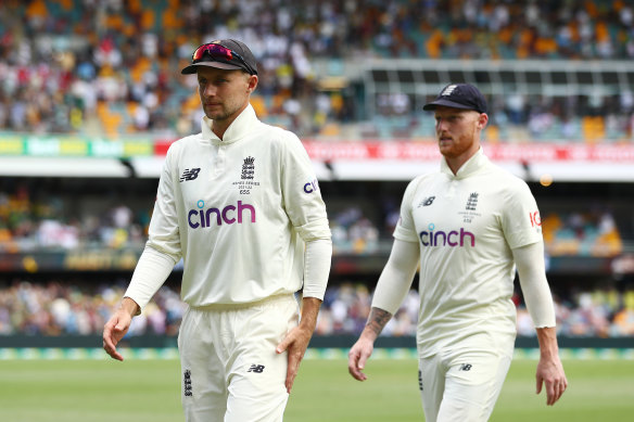 Joe Root and Ben Stokes leave the field after the Gabba loss.
