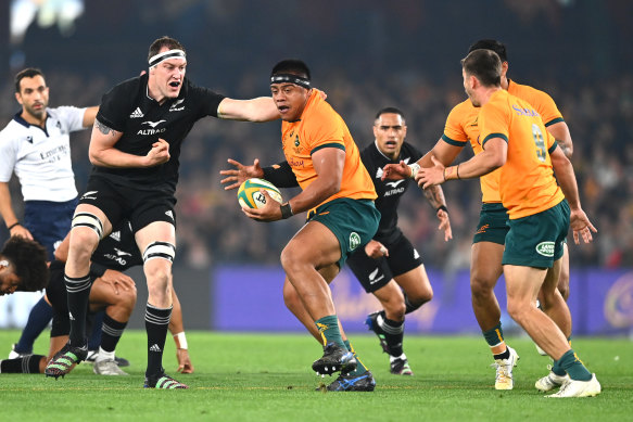 Brodie Retallick of the All Blacks tackles Allan Alaalatoa of the Wallabies.