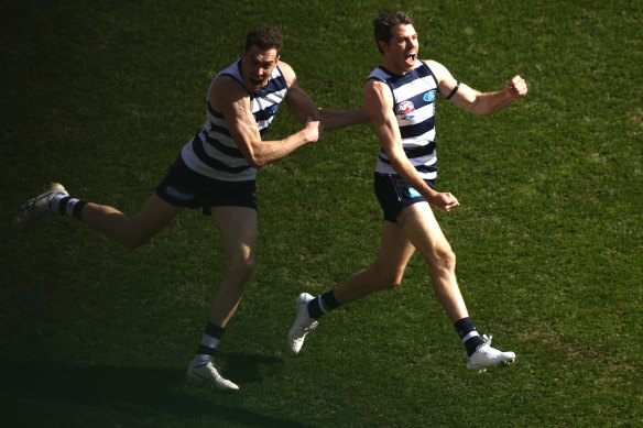 Isaac Smith, right, celebrates one of his goals.