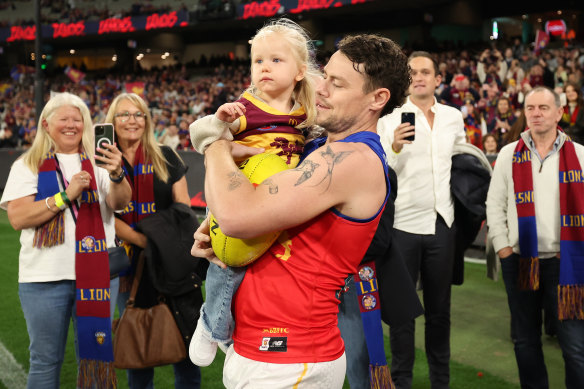 Neale with his wife, Jules, and daughter Piper Rose as he heads out to face the the Demons in his 250th AFL match.