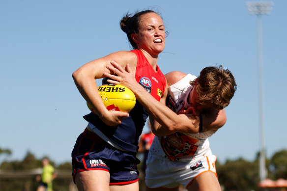 Daisy Pearce tries to break free from a tackle.