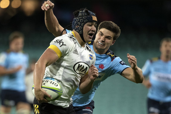 Waratah Jack Maddocks makes a tackle in the try-fest loss to the Hurricanes.