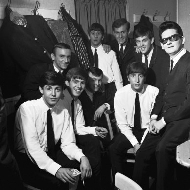 The Beatles pose with Roy Orbison and Gerry and the Pacemakers backstage in their dressing room during a 1963 British tour. From left: Paul McCartney, Freddie Marsden (behind), George Harrison, Gerry Marsden, Ringo Starr (back), Les Maguire (back), John Lennon, John 'Les' Chadwick (back), Roy Orbison. 