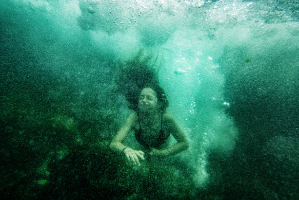 A swimmer cools off at Clovelly on a hot summer day.