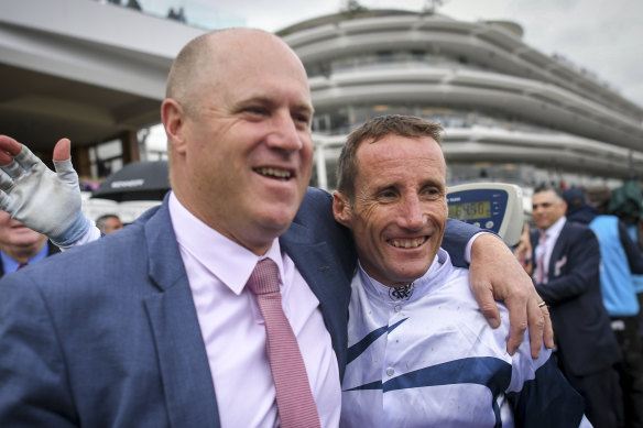 Oaks-winning trainer Danny O'Brien and jockey Damien Oliver after last year's win with Miami Bound.