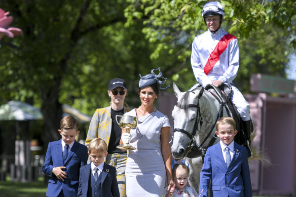 Jockey Kerrin McEvoy and wife Cathy with their children at the launch of the Melbourne Cup Carnival.