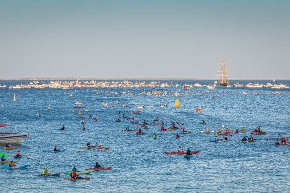 Thousands of swimmers take off from Cottesloe Beach at a previous swim.