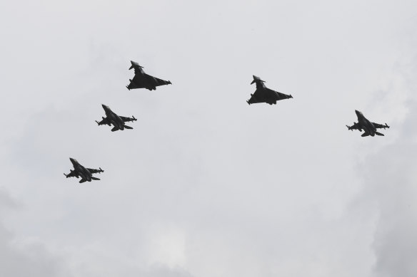 Escorted by two Eurofighter jets of the German air force Luftwaffe, three Israeli F-16 jets arrive at the Noervenich airbase in Dueren, Germany, on Monday.