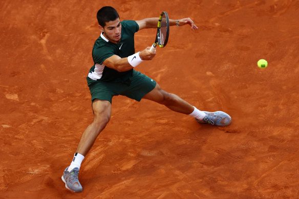 Carlos Alcaraz rips a forehand at Alexander Zverev during the final.