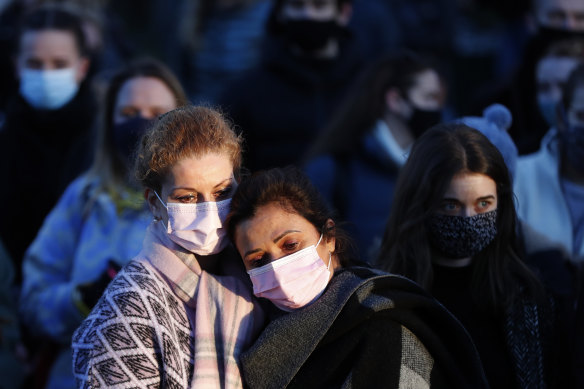 People gather in Clapham Common, in memory of Sarah Everard, after an official vigil was cancelled, in London.