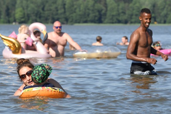 People enjoy hot summer day in a lake in Espoo, Finland.