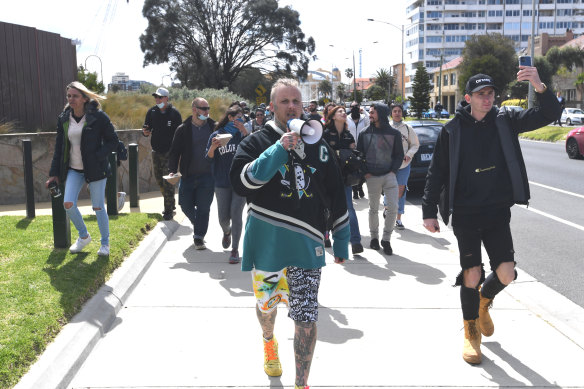 Protesters march along Marine Parade in St Kilda.