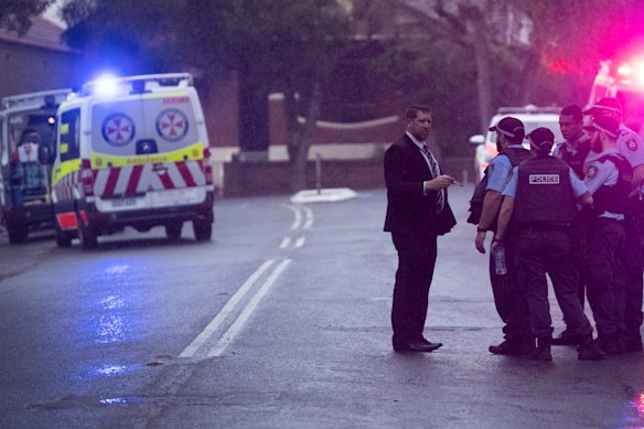 Police at the scene in Henry Street, Lewisham, where a man was shot dead and another man was in a critical condition.