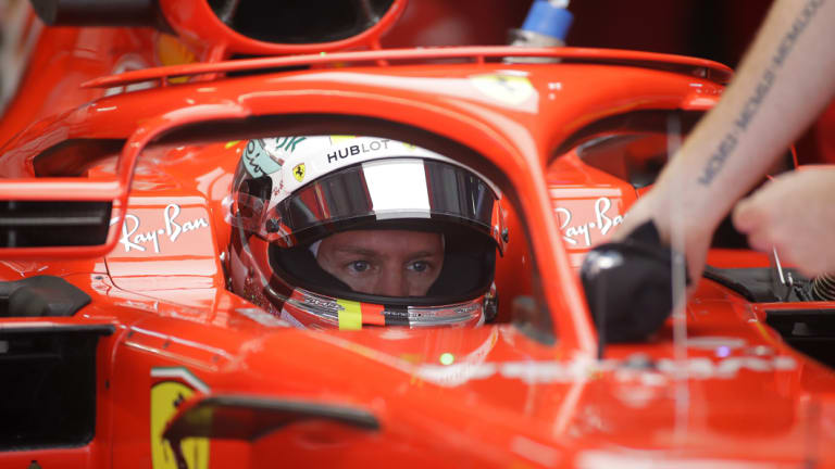 Fastest: Ferrari driver Sebastian Vettel of Germany has his car attended prior to a free practice session at the Sochi Autodrom circuit.