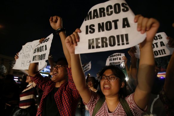 November 2016: Protesters oppose the burial of former Philippines dictator Ferdinand Marcos at the People's Power Monument in Quezon city, north of Manila.