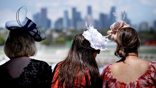 Racegoers on the Lexus marque balcony.