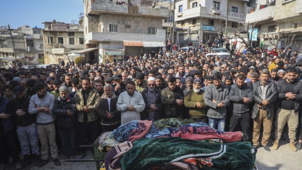 Males in the village of Al-Janoudiya during the funeral of four Syrian security force members killed in clashes with Assad loyalists.