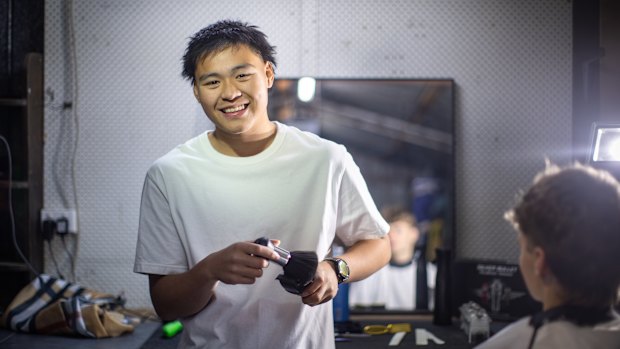 Nathan Yin in his parents’ garage where he has set up his barber business Yinny Fadezz. 